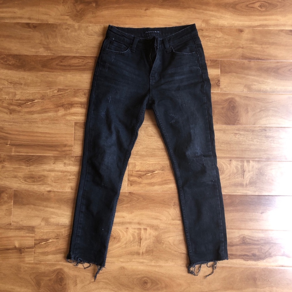 Distressed black skinny jeans